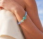 Sunshine Dreams Murano glass bracelet on a model's wrist, rhodium finish over brass, handcrafted in Italy.