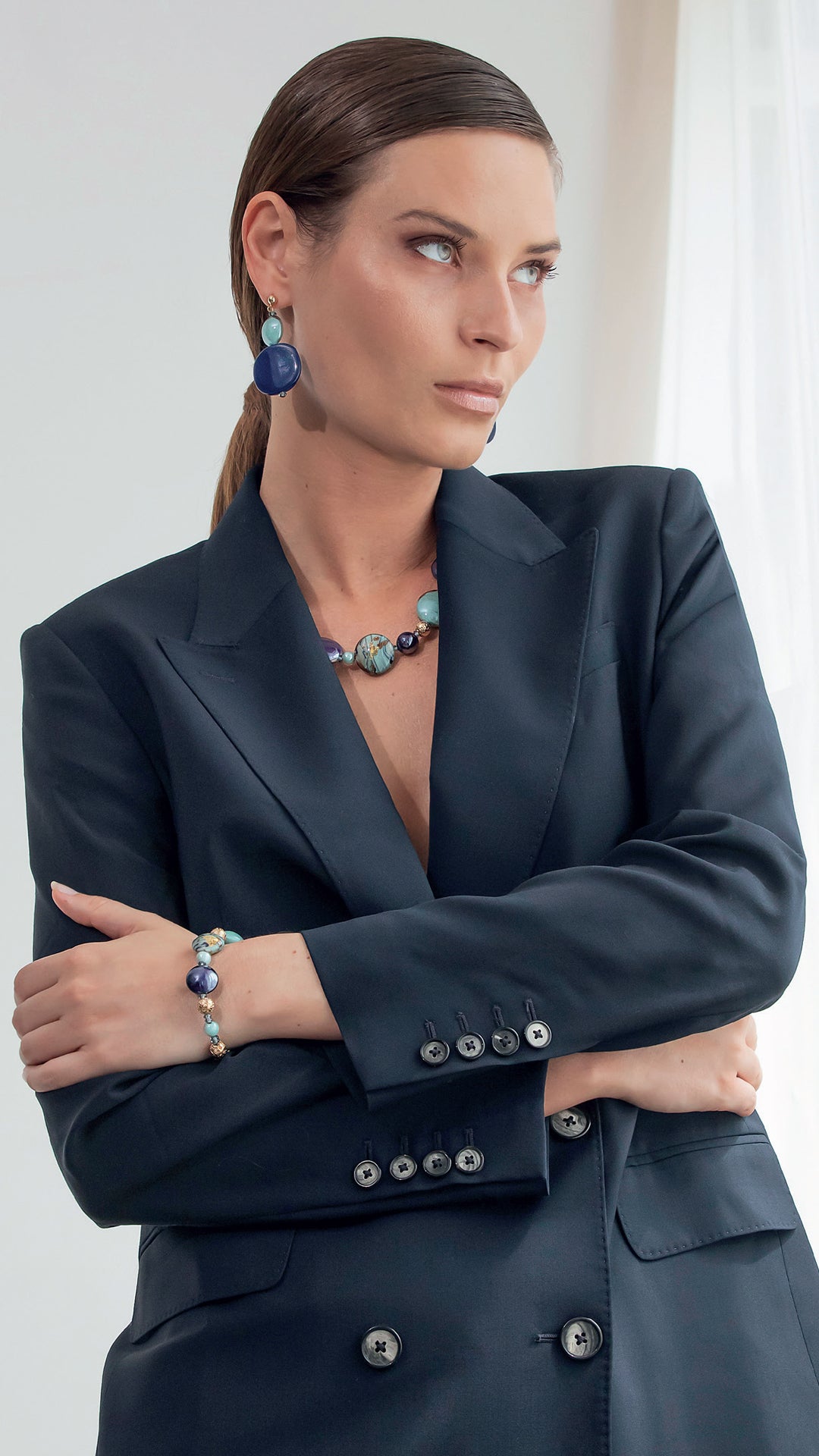 Model wearing colorful Venetian glass necklace from the Gaia Collection by MURRINAMURANO venezia