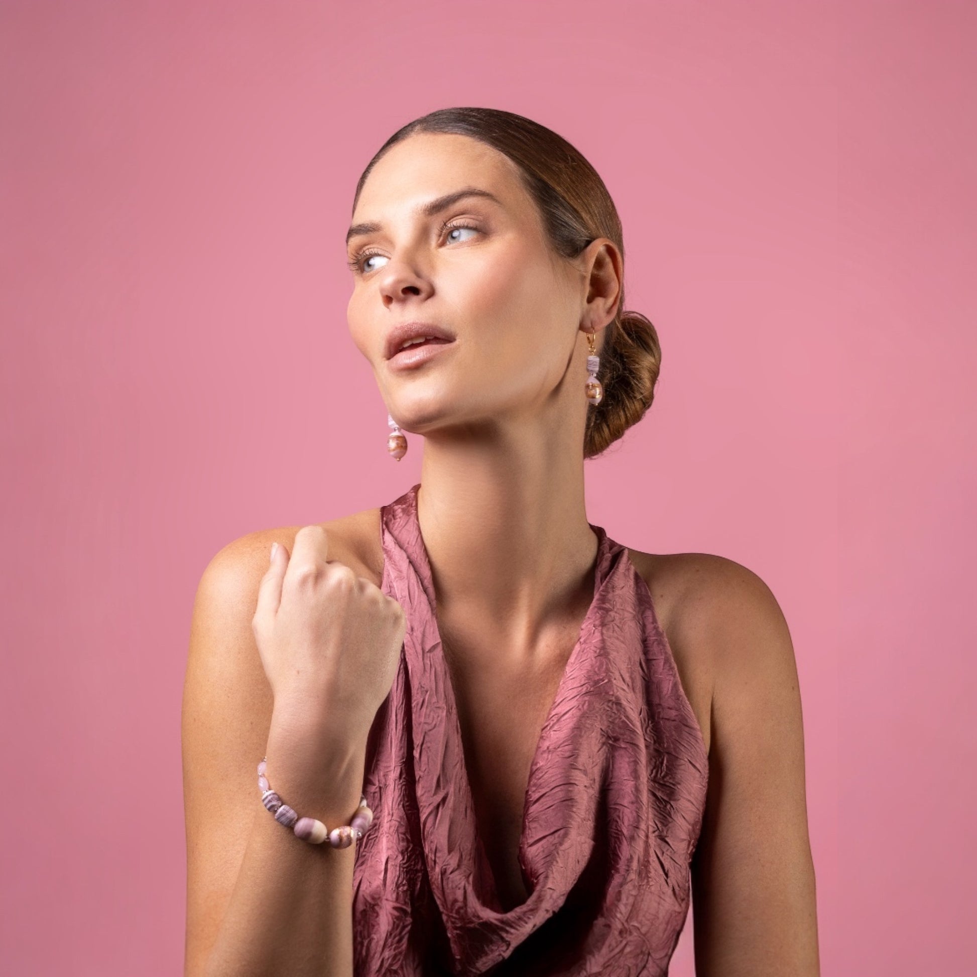 MurrinaMurano.us Blush Collection bracelet with pink and ivory Murano glass beads and gold detailing, worn by a model.