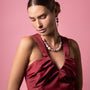 MurrinaMurano.us Blush Collection Murano glass collier necklace with purple and white beads on a model wearing a maroon dress.