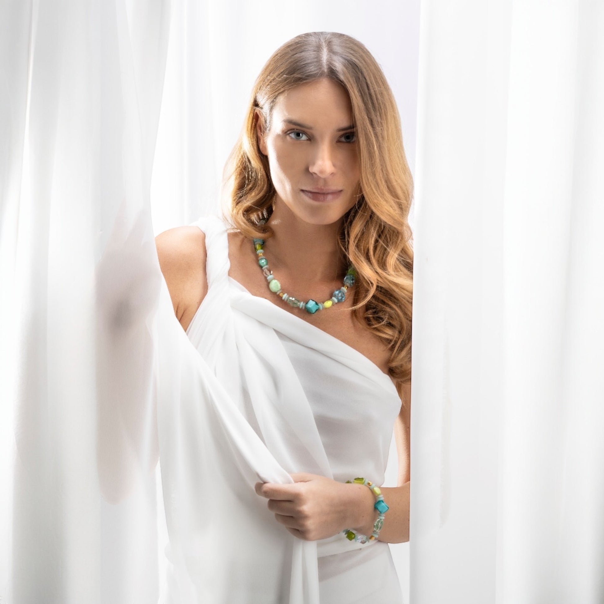 MurrinaMurano.us Evoque bracelet with multi-colored Murano glass beads, brass accents, and gold finish. Adjustable length.