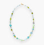 MurrinaMurano.us Evoque necklace with Murano glass beads in shades of blue, green, and clear, accented with gold-plated brass and stainless steel. 27.5 inches long.
