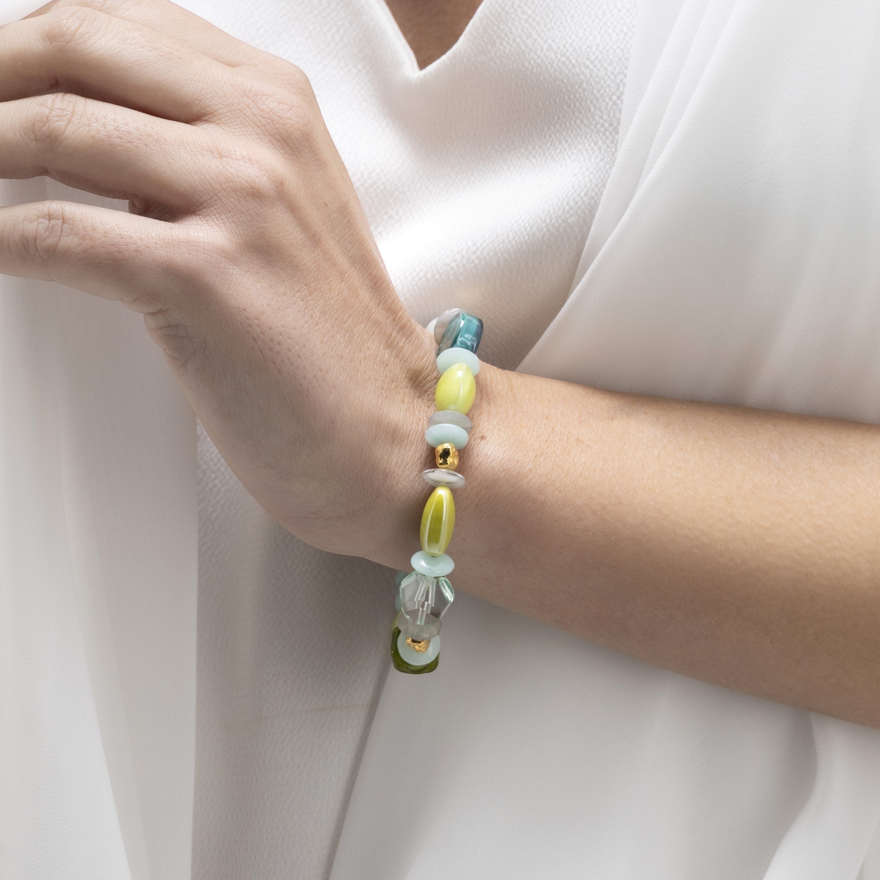MurrinaMurano.us Evoque bracelet with Murano glass beads in pastel green, yellow, and blue, accented with gold-plated brass. Contemporary design.