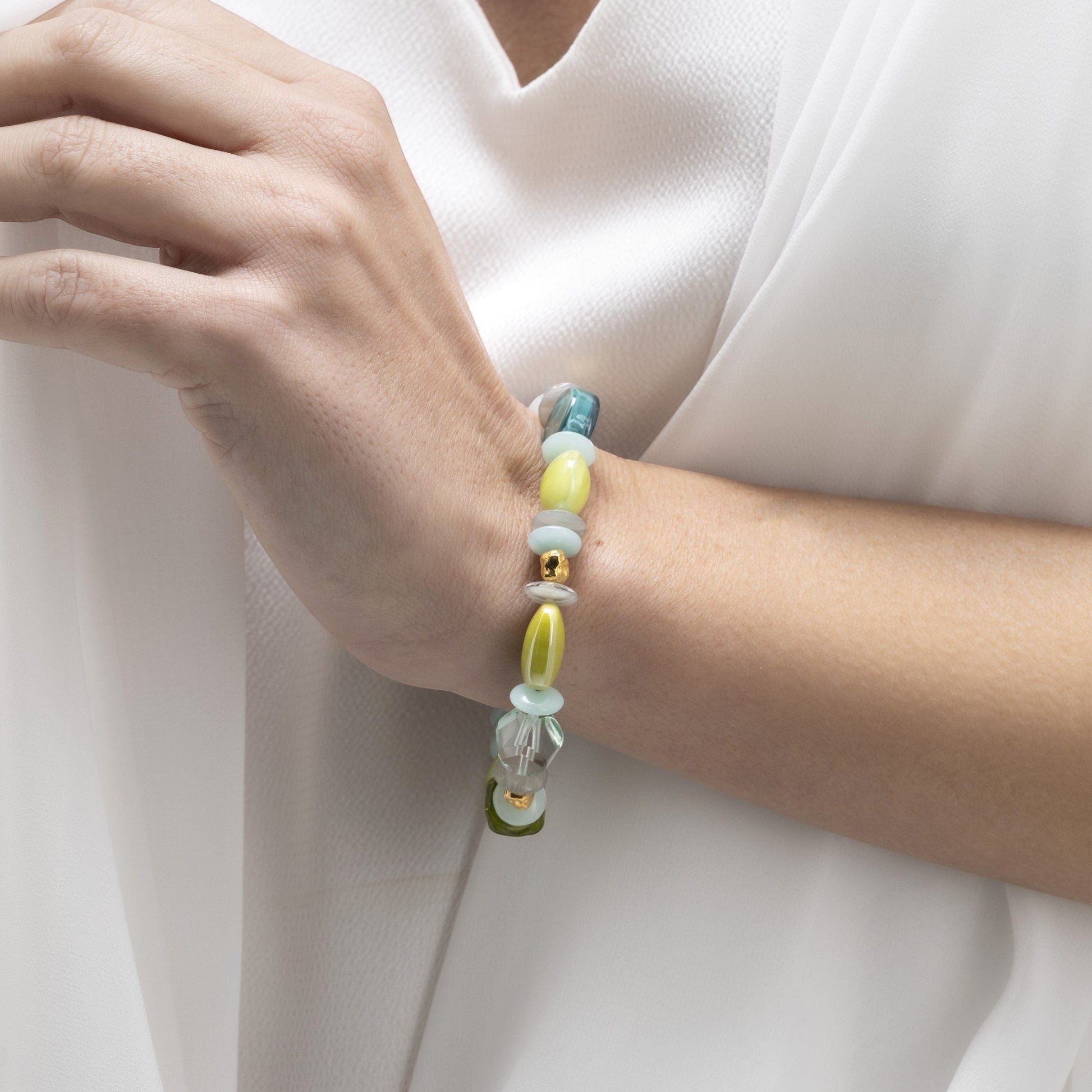 MurrinaMurano.us Evoque bracelet with Murano glass beads in pastel green, yellow, and blue, accented with gold-plated brass. Contemporary design.