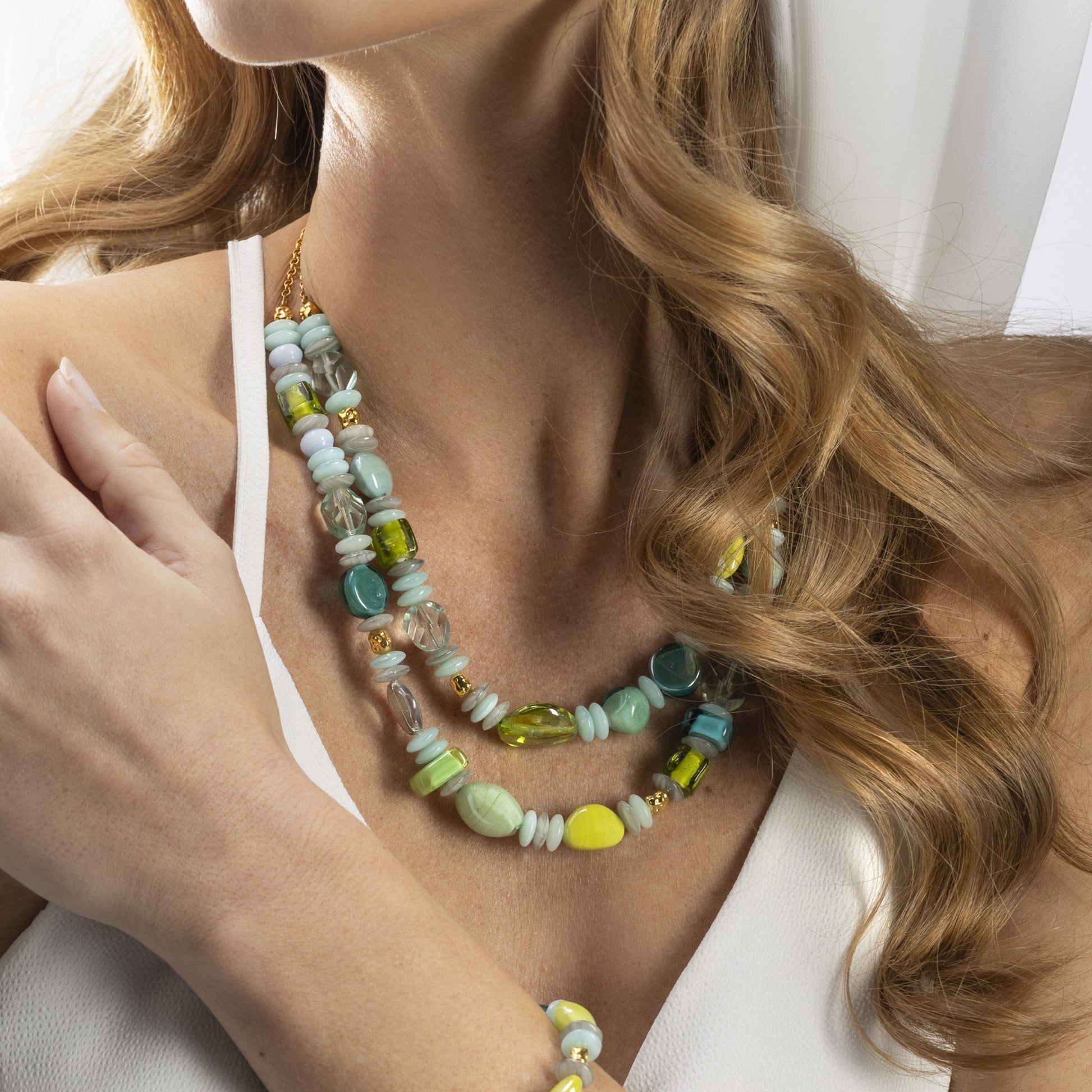 MurrinaMurano.us Evoque Collection double strand necklace with green, blue, and yellow Murano glass beads and gold-tone accents.
