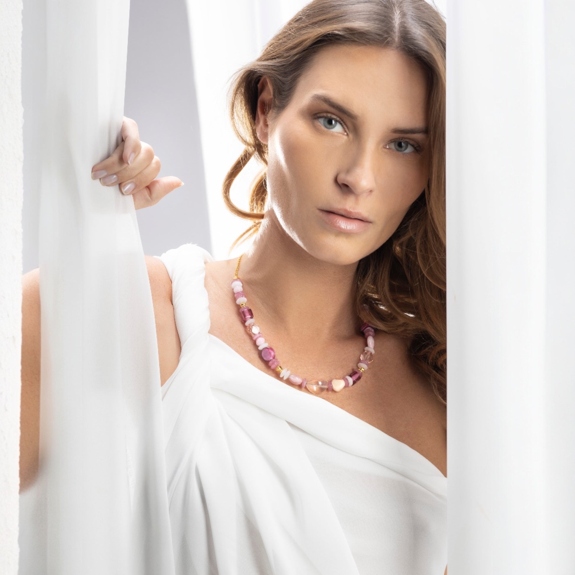 MurrinaMurano.us Evoque Collection necklace with pink Murano glass beads and gold-plated brass accents.