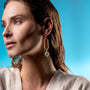 MurrinaMurano.us gold link drop earrings with green Murano glass beads and stainless steel accents.