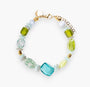 MurrinaMurano.us Evoque bracelet with mixed glass beads in blue, green, and gold, featuring an 18kt gold finish over brass clasp and charm.