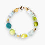 MurrinaMurano.us Evoque bracelet with Murano glass beads in green, yellow, blue, and clear, accented with gold-plated brass and stainless steel.