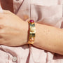 Model wearing MURRINAMURANO Venezia bracelet from the Seaside Serenity Collection, handcrafted in Original Murano glass, 18KT Gold Finish  over Brass. Made in Italy – murrinamurano.us